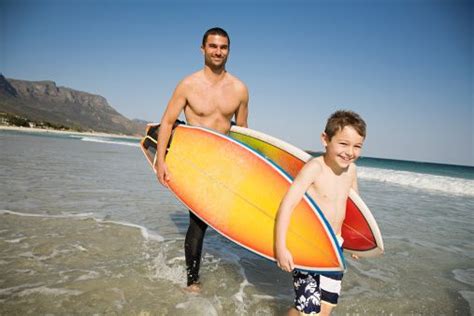Father And Son Carrying Surfboards In From The Sea Picture Id134573991 507×338 Sea Pictures