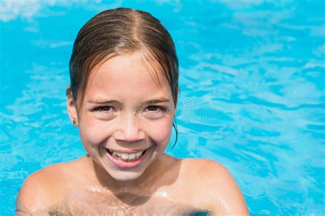 Pretty Young Girl In The Water Kid In Swimming Pool Is Smiling Stock