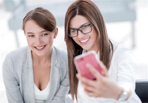Two Business Women Taking Selfies In The Office Stock Photo Image Of