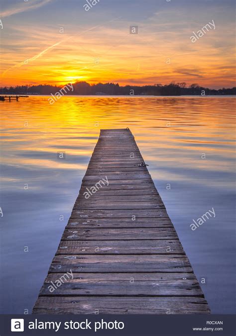 Sunset Over Serene Water Of Lake Paterwoldsemeer Stock Photo Alamy