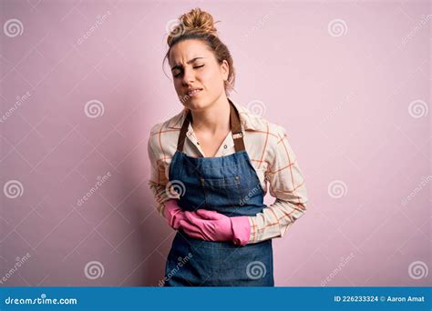 Young Beautiful Blonde Cleaner Woman Doing Housework Wearing Arpon And