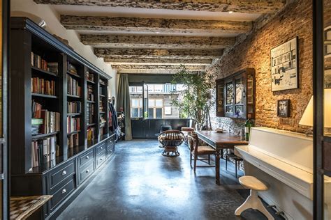 If you're looking to shake up your industrial style, add blooming plants or soft textured rugs to your space. A Stunning Industrial Garage Conversion in Amsterdam