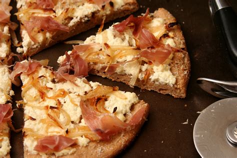 Pizza With Ricotta Caramelized Onions And Prosciutto