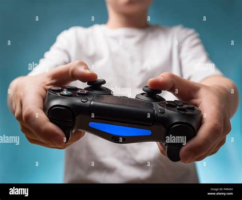 A Child Playing Computer Games With A Ps4 Playstation Four Controller