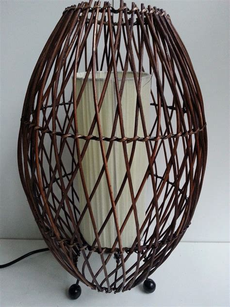 Distinctive rosewood veneer and rattan trim blend with decorative bamboo top panels and the leather writing surface to make this desktop is refined yet relaxed. BALI BAMBOO WOOD RATTAN WICKER OVAL DESK LAMP LANTERN ...