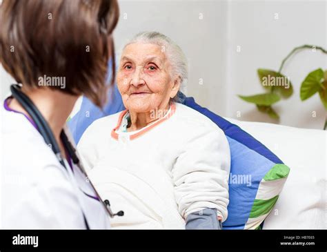 Young Nurse Caring For Elderly Patients Helping Their Days In Nursing