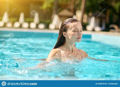 A Beautiful Slim Woman In A Swimming Pool Stock Image Image Of
