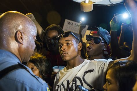 Ferguson Protests Cop Who Pointed Rifle Quits Another Fired