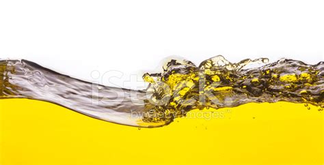 Abstract Image Of A Yellow Liquid Spilled On A White Background Stock