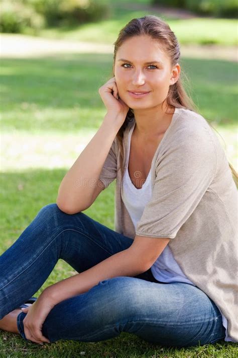 Thoughtful Woman Sitting On The Lawn Stock Photo Image Of Lifestyle