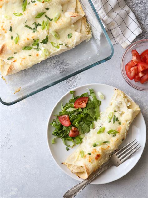 The sour cream makes the green sauce for the enchiladas extra creamy and the cheese melts in the oven. Sour Cream Chicken Enchiladas - Completely Delicious