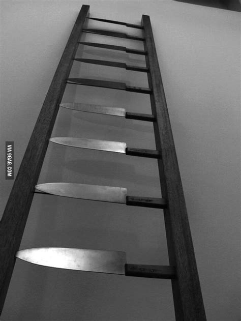 There Is A Ladder That Has Several Knives On It And The Bottom One Is