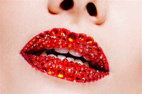red lips covered with rhinestones beautiful woman with red lipstick on her lips stock image
