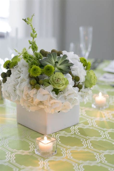 Centerpiece Of White Hydrangeas Succulents And Green