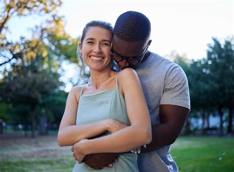 Premium Photo Happy Interracial Couple Hug And Smile For Love Care Or