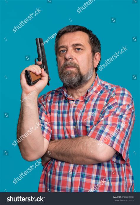 Portrait Handsome Man Holding Gun Bearded Stock Photo 1528817768