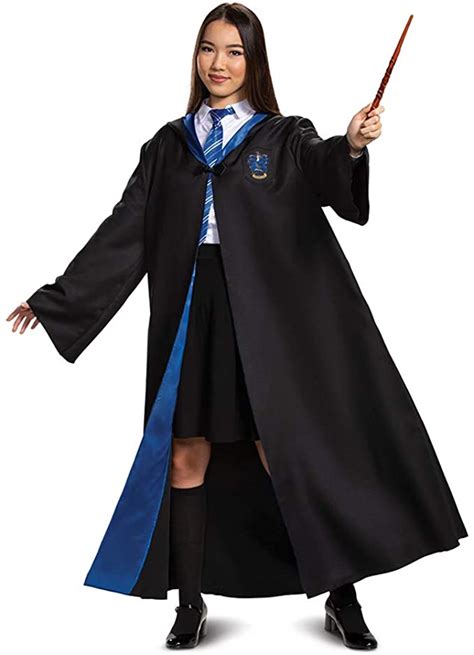 A Woman In A Harry Potter Costume Is Holding A Wand And Posing For The