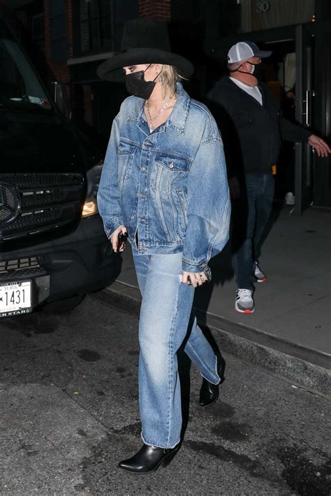 Miley Cyrus Sports Double Denim While Leaving A Building In New York