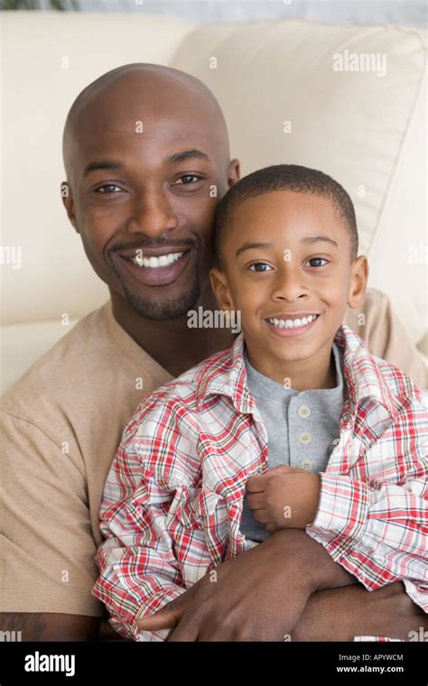 African Father And Son Hugging Stock Photo Alamy