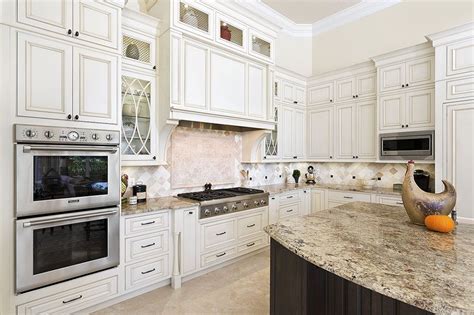 I chose shiloh cabinets in soft white and coffee brown granite countertops (which are black and brown). Shiloh Cabinetry Finish: Soft White w/Cafe Highlight Glaze Door style: Montgomery Cabinet type ...
