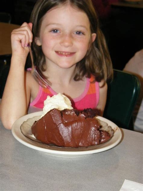 Eating Three Layer Chocolate Cake With A Scoop Of Vanilla Ice Cream No Wonder Shes Smiling