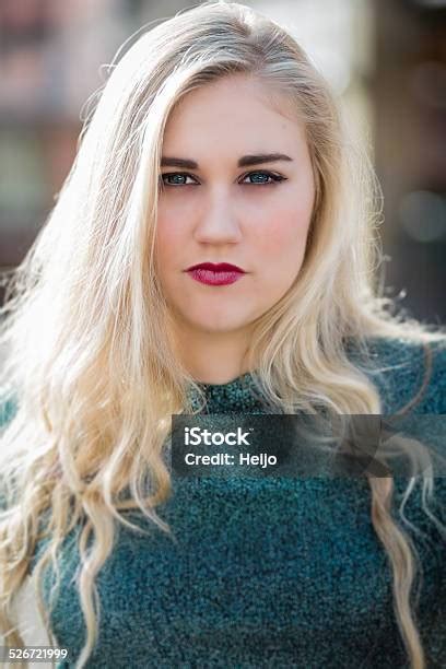 Blue Eyed Blond Teenage Girl With Lipstick And Green Tshirt Stock Photo