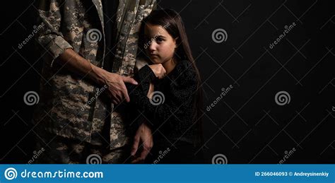 Masculine Sad Military Man Hugging Her Upset Daughter Indoors Stock