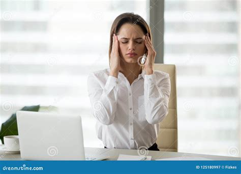 Stressed Frustrated Female Employee Feeling Headache Or Migraine Stock