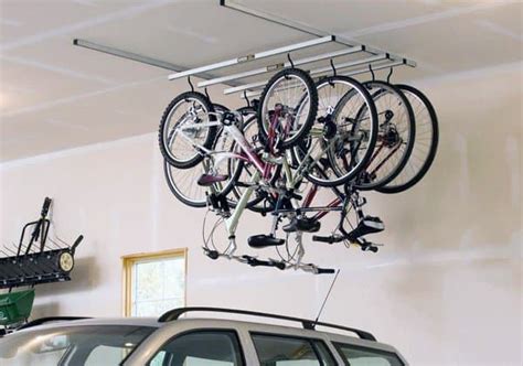 Bicycle hoisted and excess pulley rope attached to wall holder. Top 70 Best Bike Storage Ideas - Bicycle Organization Designs
