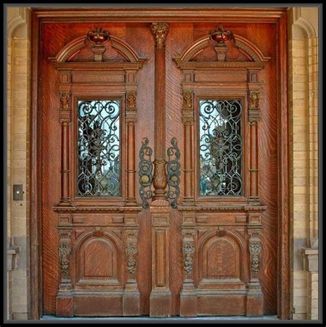 Plus, the symmetrical light sconces, wreaths, and plants really punch up the drama. Incredible Antique Wood Double Doors Home Decor More Design http://maycut.com/antique-wood-dou ...