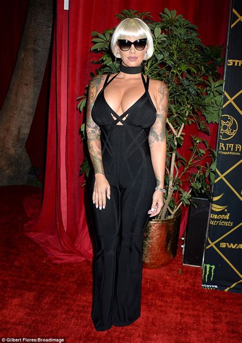 Amber Rose Nearly Bursts Out Of Daringly Low Cut Jumpsuit At Maxim Hot