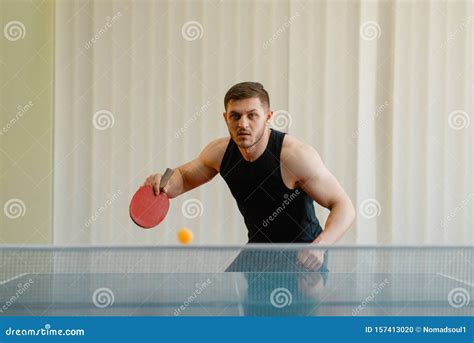 Man With Racket And Ball Playing Ping Pong Indoors Stock Photo Image