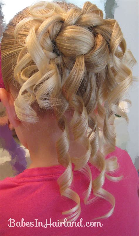 Hairstyles for little girls are such cute things to do. Feather Braided Bun - Babes In Hairland