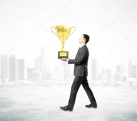 Businessman Carrying Cup Trophy Stock Photo By ©peshkov 109788760