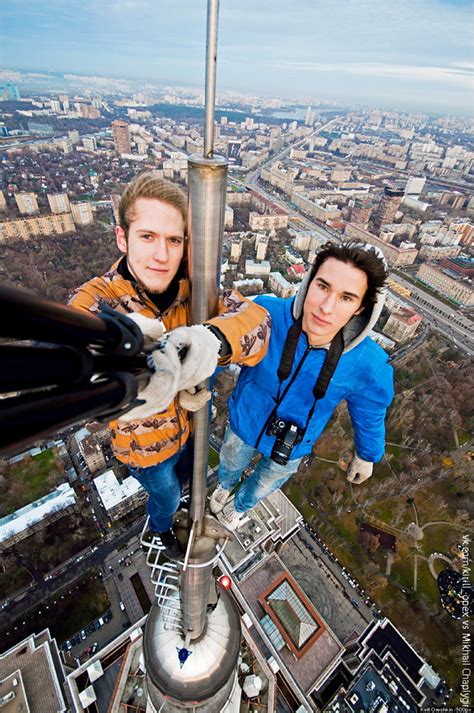 Russian Daredevil Takes Insane Selfies Dangling From The Top Of High