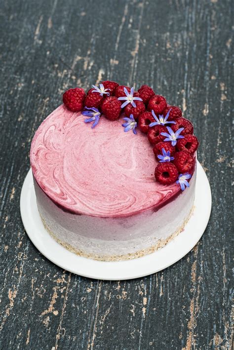 Oreo cookie crust with a raspberry cheesecake filling, topped with raspberry sauce and whipped cream. Vegan Raspberry Cheesecake - Vegan Family Recipes