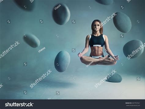 Young Woman Yogi Levitation And Meditation Concept Objects Flying In