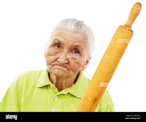 Angry Old Woman Holding A Rolling Pin In Her Hand Stock Photo Alamy