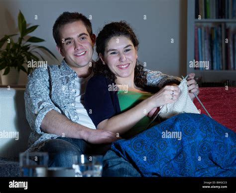 Couple Cuddling Watching Television Stock Photo Alamy