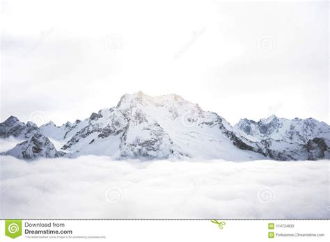 Amazing View Of Great Snow Covered Winter Mountains Above The Clouds