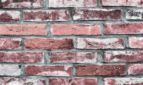 Detailed Closeup View On Aged And Weathered Red Bricks Walls In A