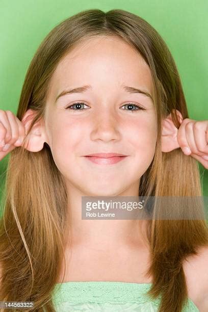 Girl Pulling Face Photos And Premium High Res Pictures Getty Images