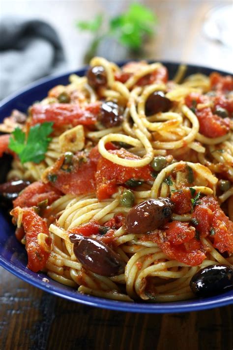 spaghetti alla puttanesca is an incredibly simple dinner that is perfect for busy we… in 2022