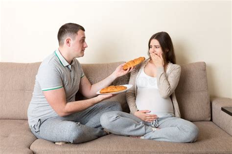 Husband Offers Croissants To His Pregnant Wife But She Refuses And Makes Stop Gesture Because