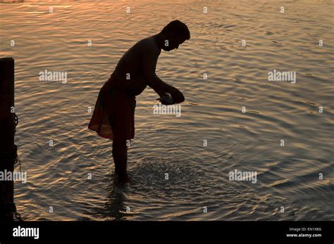 india uttarakhand rishikesh pilgrim performing ritual washing in the river ganges holy river