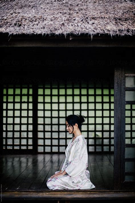 Beautiful Japanese Woman In Casual Silky Kimono Sitting In Traditional
