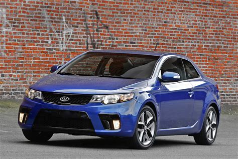 The 2012 forte koup's tight suspension can sometimes result in a harsh ride over rough road surfaces, and the rear seat remains a tight fit for 3 taller adults. 2012 Kia Forte Koup - HD Pictures @ carsinvasion.com