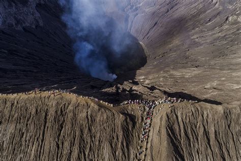 Tourist Standing At Volcano Crater Of Mt Bromo Smithsonian Photo