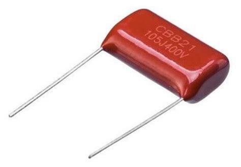 The Capacitor Is Red And Has Two Pins Attached To Each End That Are