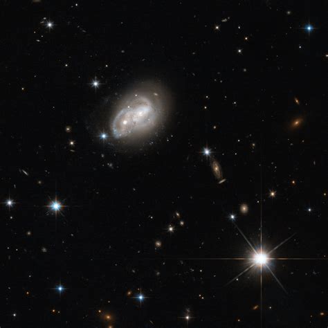 Hubble Views Two Spiral Galaxies Engaged In A Cosmic Tug Of War